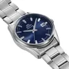 A close-up, angled shot of a men's wristwatch with a blue dial and silver metal band, set against a white background. Produktbild-Vorschau
