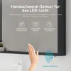A close-up view of a hand reaching towards a sensor on a cabinet. Voir les images du produit