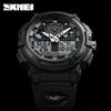 A close-up studio shot of a black SKMEI dual-time digital and analog wristwatch against a black background. Produktbild-Vorschau