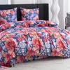 A close-up view of a floral patterned duvet cover and pillowcases on a bed. Náhled obrázku produktu