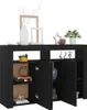 A black sideboard with decorative items on top and inside. Náhľad obrázku produktu