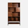 A tall, multi-compartment bookshelf with a wood-grain finish and black metal legs, set against a plain white background. Produktbild-Vorschau