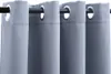 A close-up view of several gray curtains hanging from a dark curtain rod. Náhled obrázku produktu