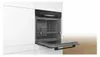 A built-in oven with its door open, showing the interior and racks. Produktbild-Vorschau