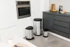 A modern kitchen scene with stainless steel trash cans. Anteprima dell’immagine prodotto