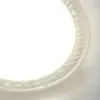 A close-up, angled view of a white LED light fixture with a textured rim. Podgląd zdjęcia produktu