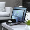 A charging station with multiple devices on a marble table, with a couch in the background. Anteprima dell’immagine prodotto