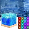 A bedroom scene with a cube-shaped lamp projecting aurora and wave light effects. Anteprima dell’immagine prodotto
