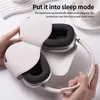 Hands holding a pair of white headphones with protective silicone covers. Podgląd zdjęcia produktu