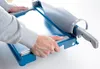Hands using a paper guillotine. Anteprima dell’immagine prodotto