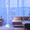 A bubble lamp with decorative fish is placed in a living room next to a sofa. Produktbild-Vorschau