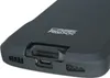 A close-up view of the bottom edge of a black mobile computer protective case, showing the charging port and speaker grilles. Podgląd zdjęcia produktu