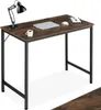 A desk with a laptop, mouse, notebook, and coffee cup on it. Náhled obrázku produktu
