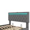 A close-up view of a gray upholstered bed frame with a tufted headboard and integrated LED lighting. Náhľad obrázku produktu