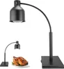 A black heat lamp with a flexible neck stands on a white background. A smaller version of the lamp is shown in the lower left corner, illuminating a roasted chicken on a plate. Produktbild-Vorschau