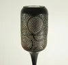 A close-up studio shot of a solar-powered LED garden light with a decorative metal casing. Produktbild-Vorschau