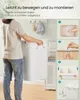 A person is holding a laundry basket next to a cabinet, with instructional steps shown on the right side. Produktbild-Vorschau