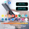 A person's hands are holding a phone and interacting with a product that has LED lighting features. Produktbild-Vorschau