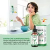 A woman eating breakfast in a kitchen, with a product bottle and box in the foreground. Produktbild-Vorschau