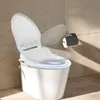A modern white bidet toilet seat is shown in a bathroom with tiled walls and floor. The toilet lid is partially open, and a blue light emanates from the seat. Podgląd zdjęcia produktu