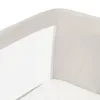 A close-up view of the corner of a baby crib or bassinet, showing the beige fabric and white mesh side. Produktbild-Vorschau