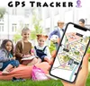 Children are sitting on a beanbag in a park, with one child holding a smartphone displaying a map. Produktbild-Vorschau
