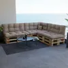 Outdoor patio furniture set with cushions on a balcony overlooking the ocean. Anteprima dell’immagine prodotto