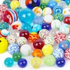 A collection of colorful glass marbles arranged on a white background. Náhľad obrázku produktu