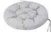 A round gray cushion with ties on the side, shown on a white background. Produktbild-Vorschau