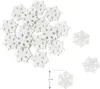 A pile of white snowflake-shaped confetti pieces, with a ruler indicating 2 cm. Produktbild-Vorschau