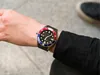 A person wearing a watch on their wrist. Produktbild-Vorschau
