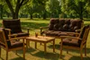 Outdoor furniture set with cushions on a grassy lawn with trees in the background. Produktbild-Vorschau