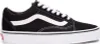 A side view of a black Vans Old Skool sneaker with a white stripe. Voir les images du produit