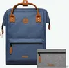 A blue backpack and a gray pouch are displayed against a white background. Voir les images du produit