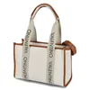 A white tote bag with brown trim and straps, featuring the Valentino logo. Anteprima dell’immagine prodotto