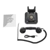 A vintage-style rotary dial telephone and its handset are laid out on a white background, along with a small instruction booklet. Podgląd zdjęcia produktu
