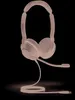 A Jabra Evolve2 30 SE UC Stereo headset with a microphone boom is shown against a black background. The headset is illuminated with a pinkish light, giving it an almost ethereal appearance. The cable is coiled neatly on the surface below. Podgląd zdjęcia produktu