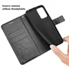 A hand is holding a black flip phone case, showing the inside with card slots and a floral embossed design. Produktbild-Vorschau
