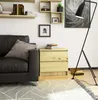A modern living room with a black leather sofa, a wooden nightstand, and a floor lamp. Podgląd zdjęcia produktu