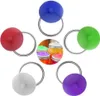 A collection of colorful silicone lids with metal rings for jars, arranged around a central inset image of jars with similar lids. Produktbild-Vorschau