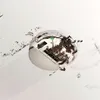 A robotic vacuum cleaner is shown with its internal components exposed, with dirt or debris scattered around it. Anteprima dell’immagine prodotto