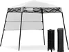 A white pop-up canopy tent is shown fully assembled, with its folded frame and carrying bag displayed to the right. Produktbild-Vorschau