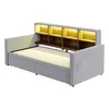 A light gray upholstered daybed with a built-in bookshelf headboard featuring wooden shelves and integrated LED lighting. Náhled obrázku produktu