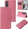 Collage of images showing a pink floral butterfly embossed flip phone case from multiple angles, including open and closed views, and with a phone inserted. Produktbild-Vorschau