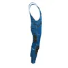 Side view of blue denim overalls with black knee patches. Náhled obrázku produktu