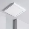 A white square LED ceiling light is mounted on a white ceiling, with parts of white walls visible in the foreground. Produktbild-Vorschau