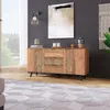 A modern living room with a wooden sideboard, artwork, and a rug. Anteprima dell’immagine prodotto