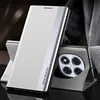 A white and silver flip case for a Xiaomi Redmi Note 14 Pro 5G is shown standing upright, with the phone's camera module visible. Produktbild-Vorschau