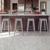 A modern kitchen island with four gray metal bar stools. Produktbild-Vorschau