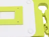 A close-up view of a white and green plastic product, possibly a kitchen gadget or organizer. Náhled obrázku produktu